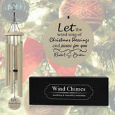 Personalized Christmas wind chime in off-white color with "Let the wind sing of Christmas blessings" engraving